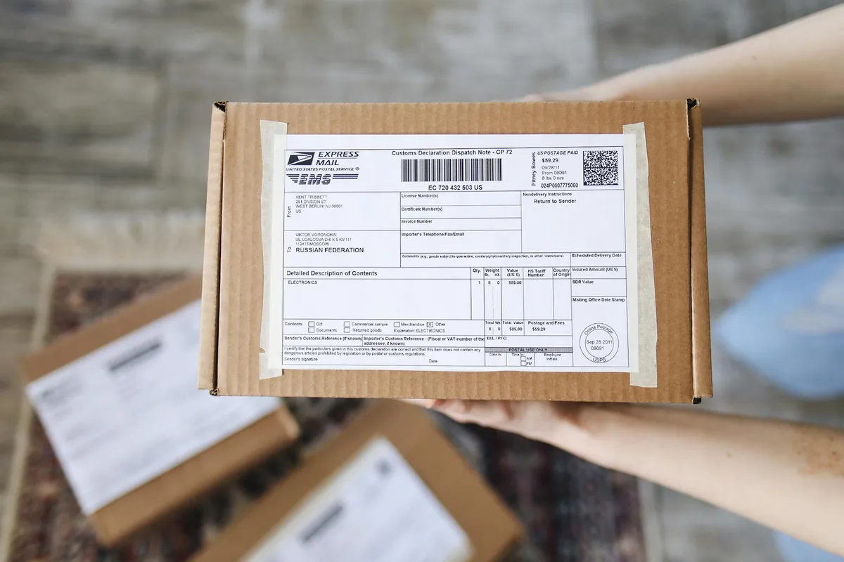 DHL Express international parcel with Malaysia origin label being prepared for international dispatch